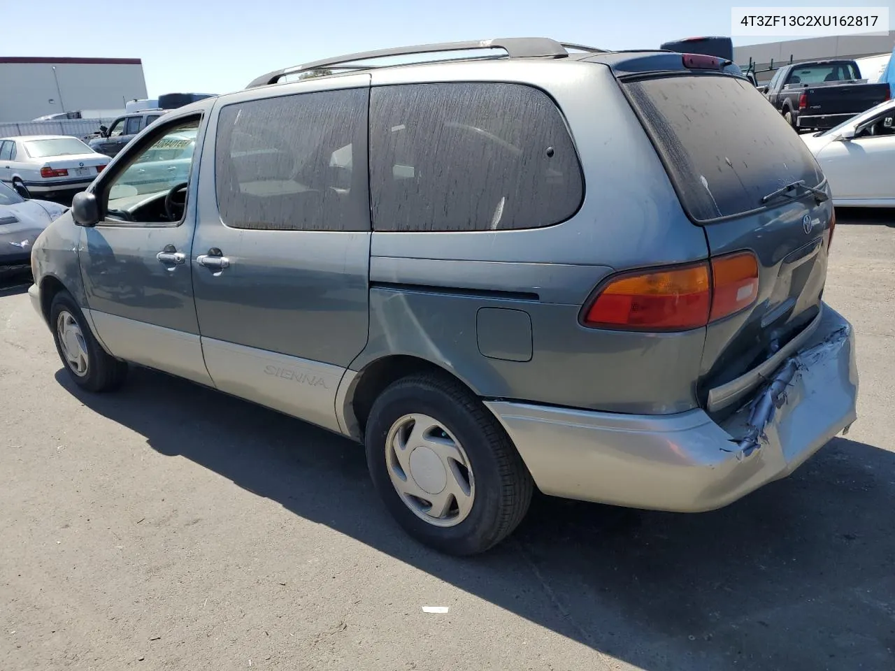 1999 Toyota Sienna Le VIN: 4T3ZF13C2XU162817 Lot: 69704604